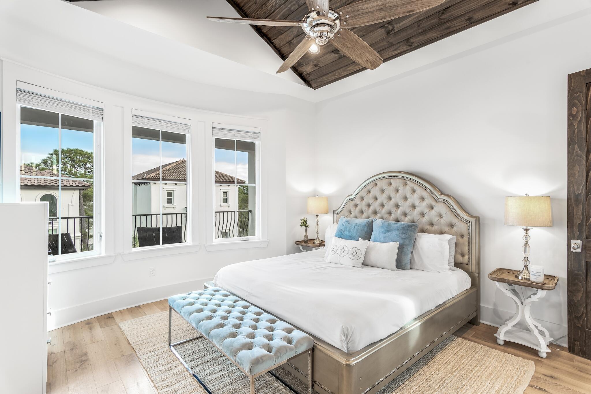 81 Palmeira Way Santa Rosa Beach, FL 32459 - Photo 40 of 74 a bedroom with a large bed and a chandelier