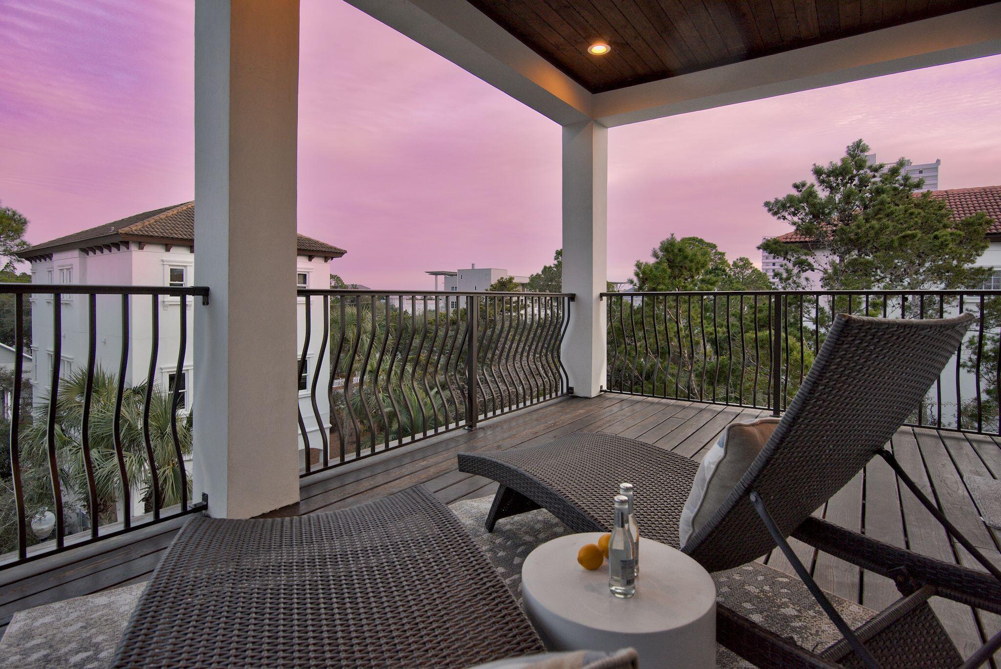81 Palmeira Way Santa Rosa Beach, FL 32459 - Photo 48 of 74 a balcony with wooden floor table and chairs