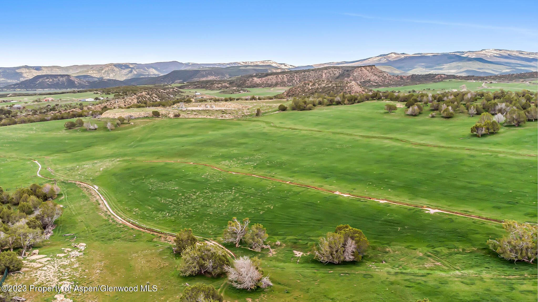 5821 County Road 331 Silt, CO 81652 - Photo 1 of 26 a view of a lush green hillside and houses