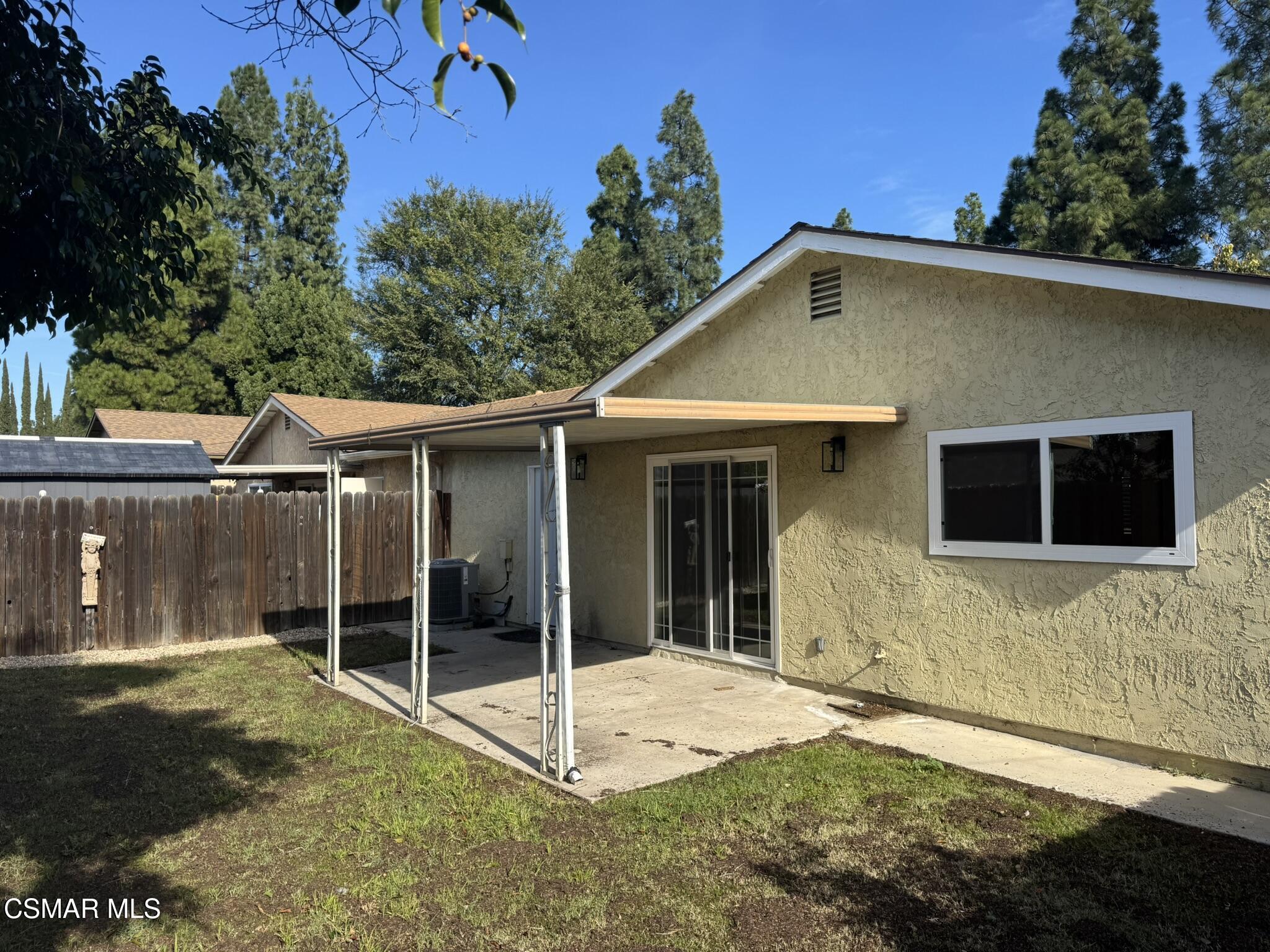 1567 Sequoia Avenue Simi Valley, CA 93063 - Photo 16 of 18 a view of a house with a backyard and a tree