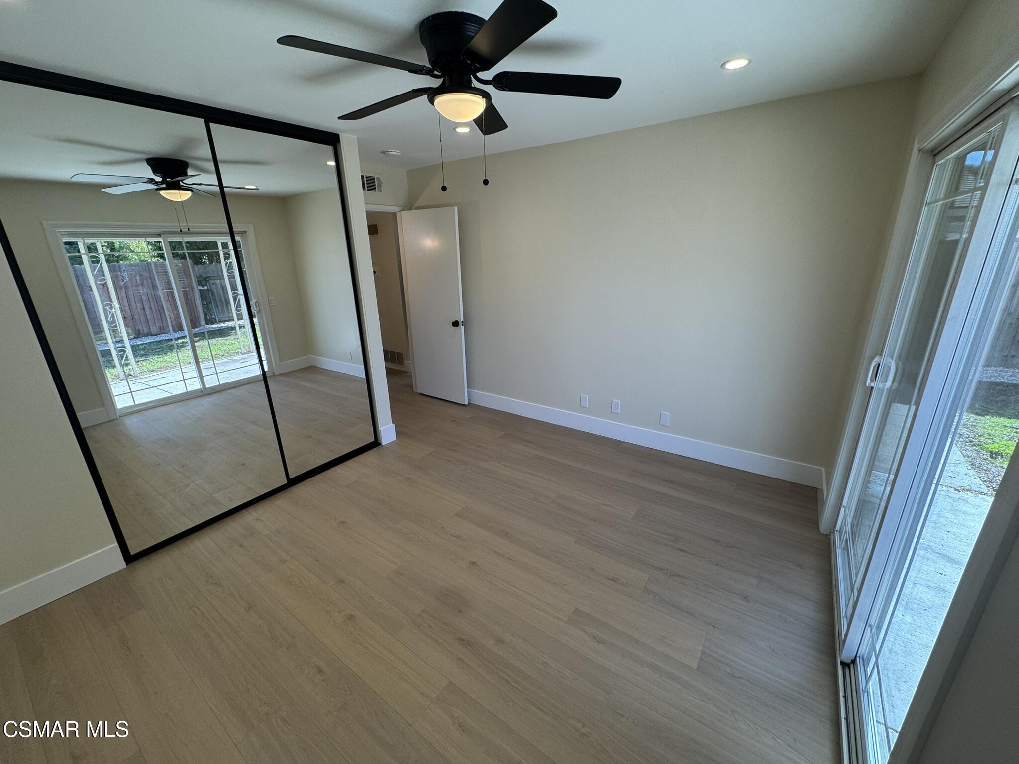 1567 Sequoia Avenue Simi Valley, CA 93063 - Photo 3 of 18 a view of empty room with wooden floor and fan
