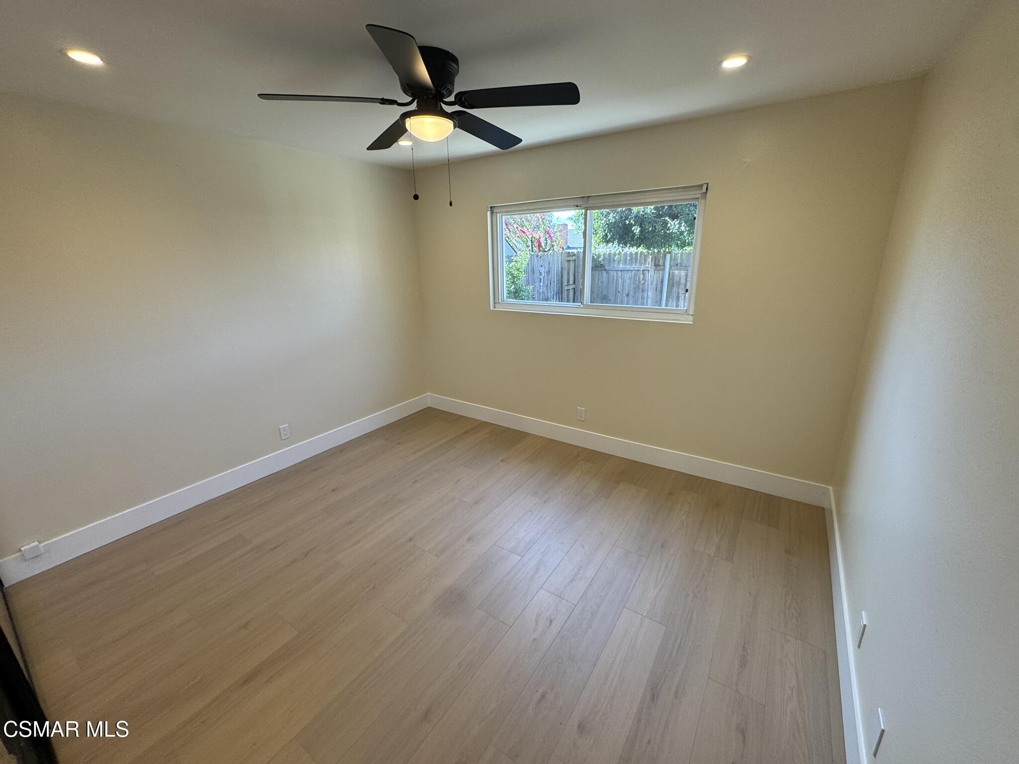 1567 Sequoia Avenue Simi Valley, CA 93063 - Photo 4 of 18 a view of empty room with wooden floor and fan