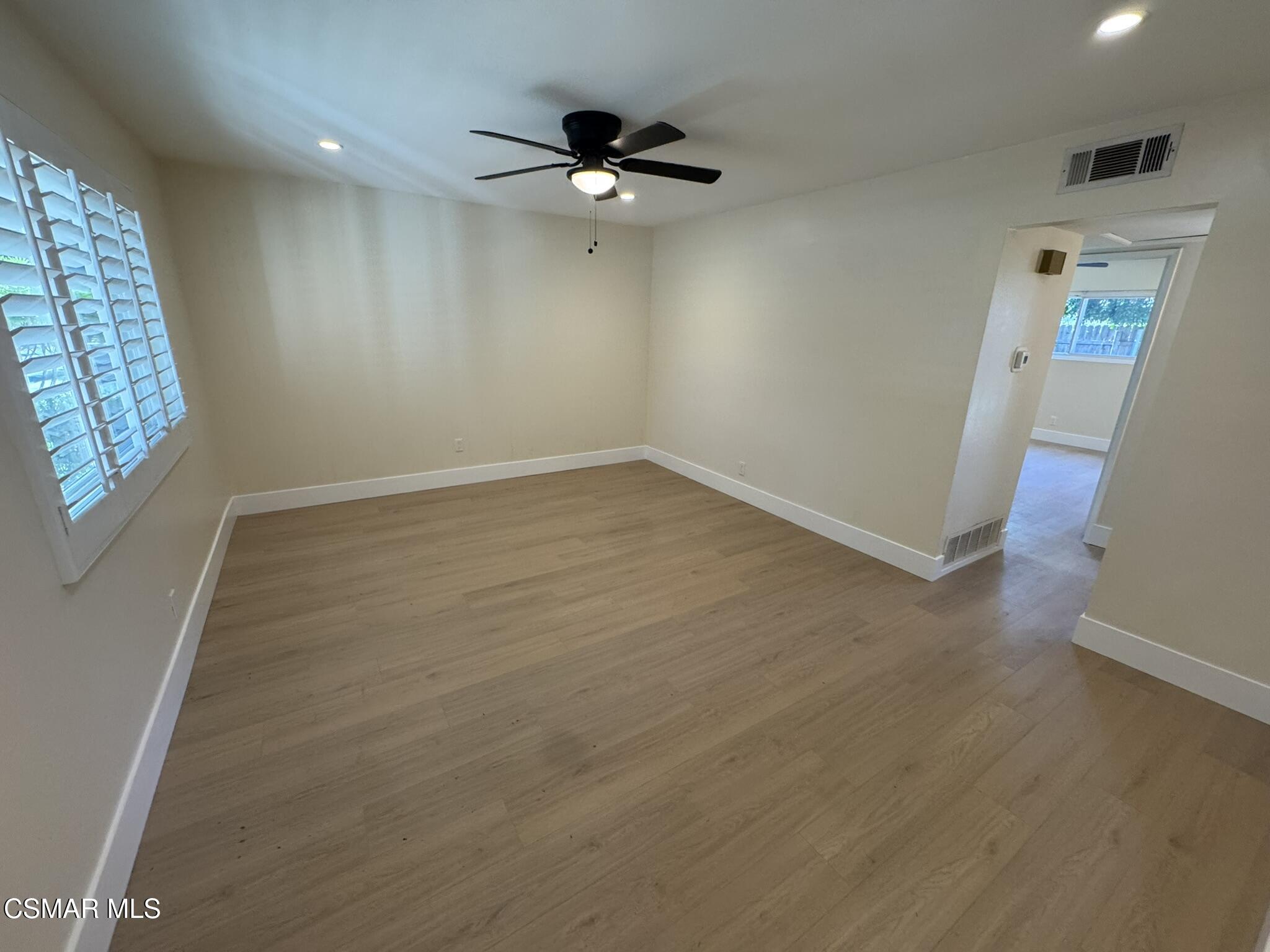 1567 Sequoia Avenue Simi Valley, CA 93063 - Photo 7 of 18 an empty room with windows and fan