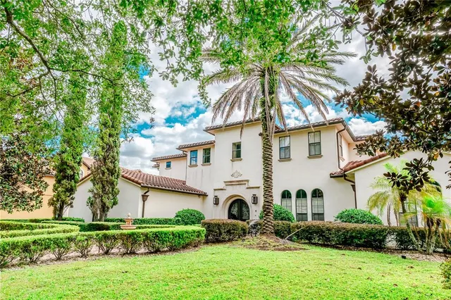 a view of a house with a yard and plants