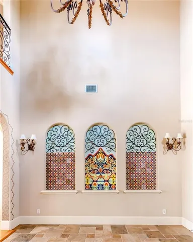 a view of a staircase with a water fall and potted plants