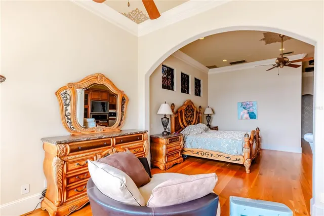 a bedroom with furniture and a wooden floor