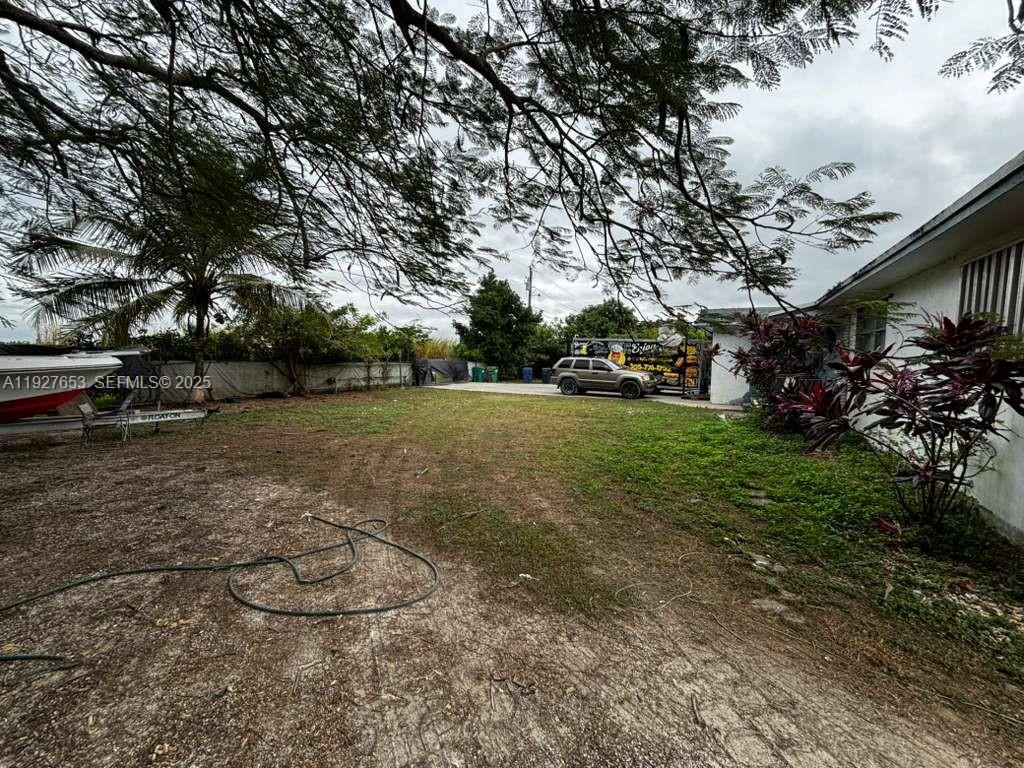 21160 Southwest 328th Street Homestead, FL 33030 - Photo 18 of 18 a view of a yard with large trees