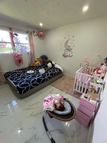 a kitchen with a stove and a chair
