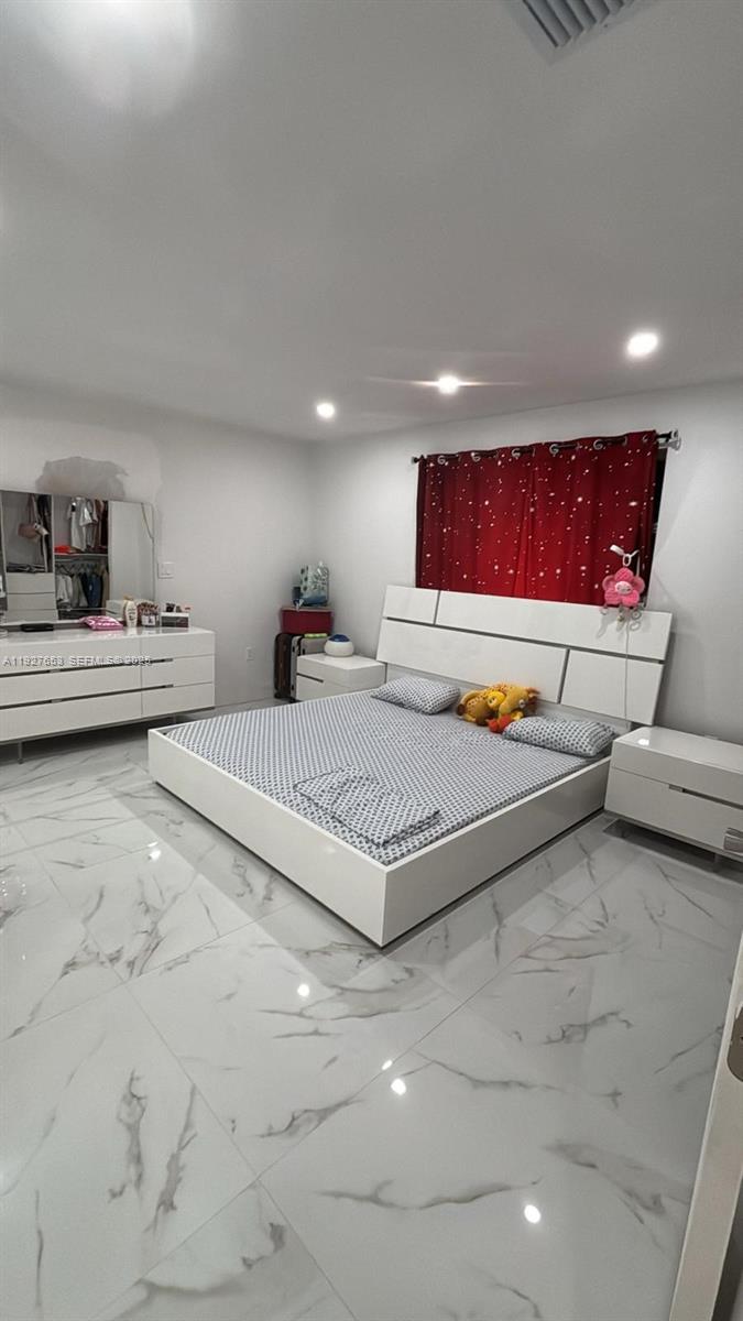 21160 Southwest 328th Street Homestead, FL 33030 - Photo 7 of 18 a living room with furniture and a couch