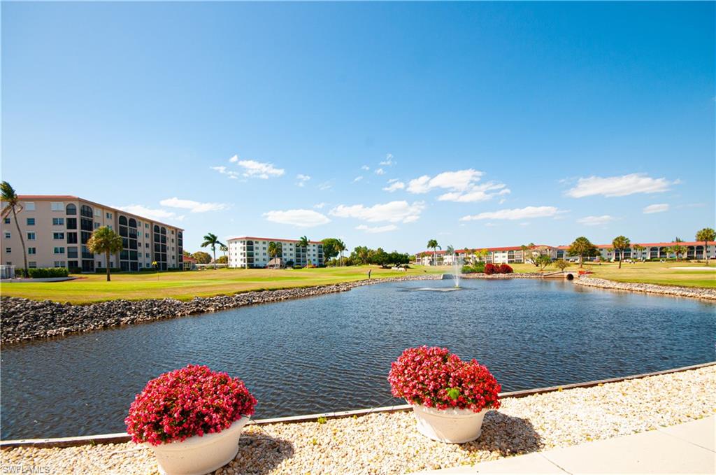 49 High Point Circle South, Unit 102 Naples, FL 34103 - Photo 3 of 42 View in front of condo