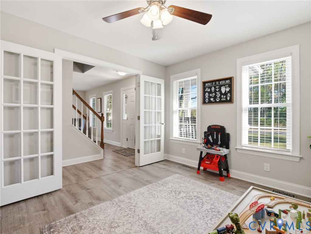 11084 West River Road Aylett, VA 23009 - Photo 11 of 36 a view of a livingroom with workspace and a window