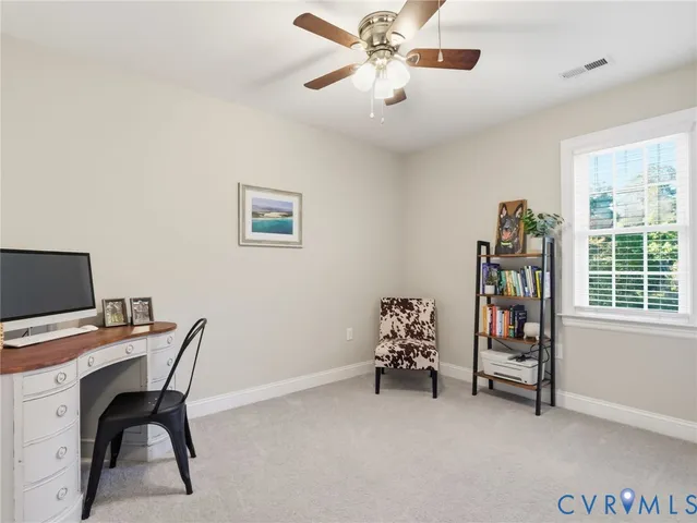 a workspace with furniture and window