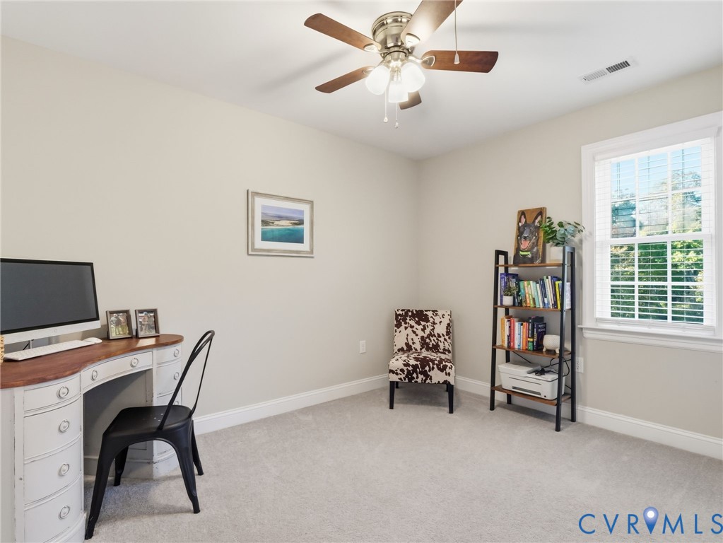 11084 West River Road Aylett, VA 23009 - Photo 12 of 36 a view of a workspace with furniture and a window