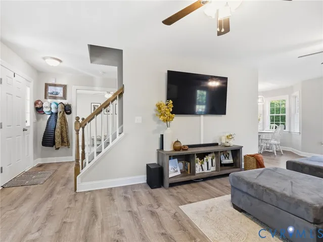 a room with furniture and a flat screen tv