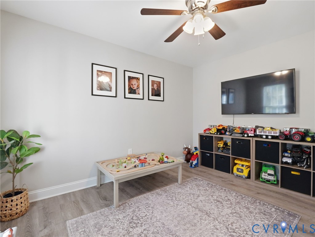 11084 West River Road Aylett, VA 23009 - Photo 15 of 36 a room with furniture and a flat screen tv