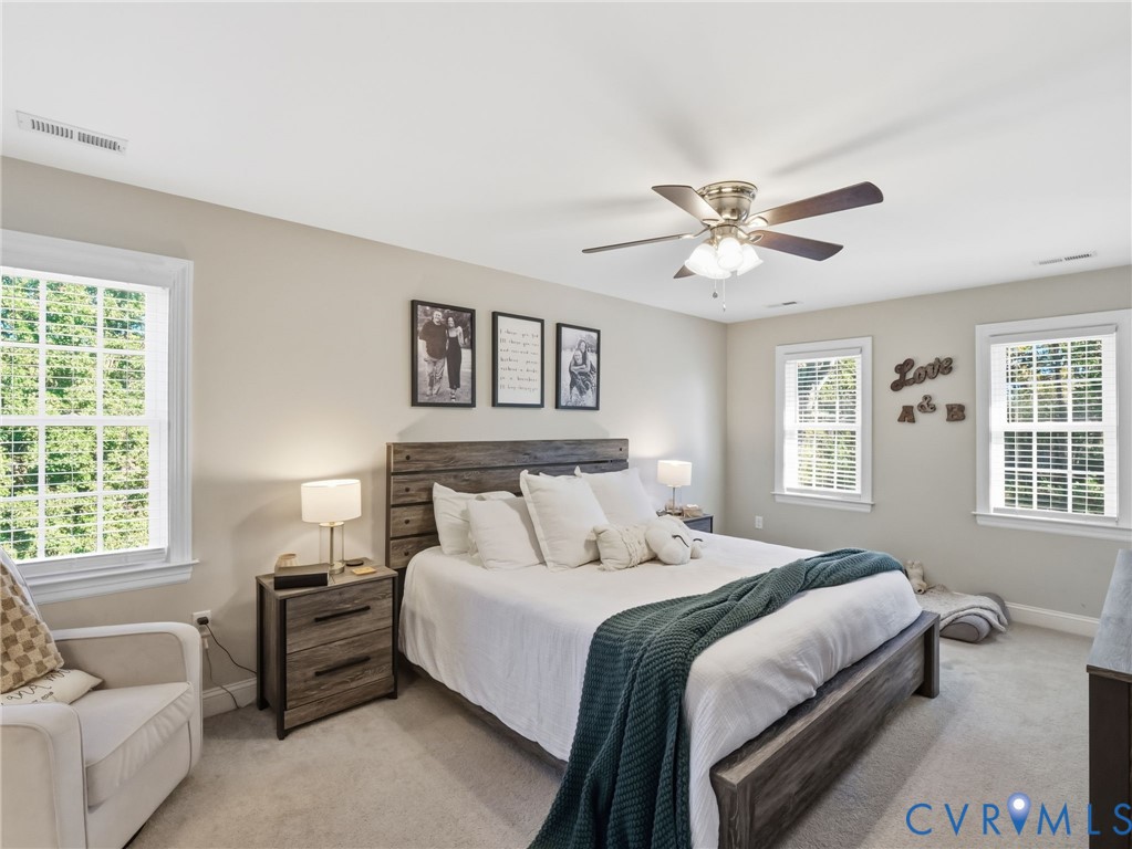 11084 West River Road Aylett, VA 23009 - Photo 17 of 36 a bedroom with bed couch and window