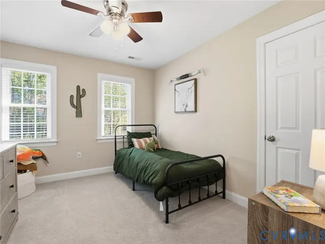 a bedroom with furniture and window