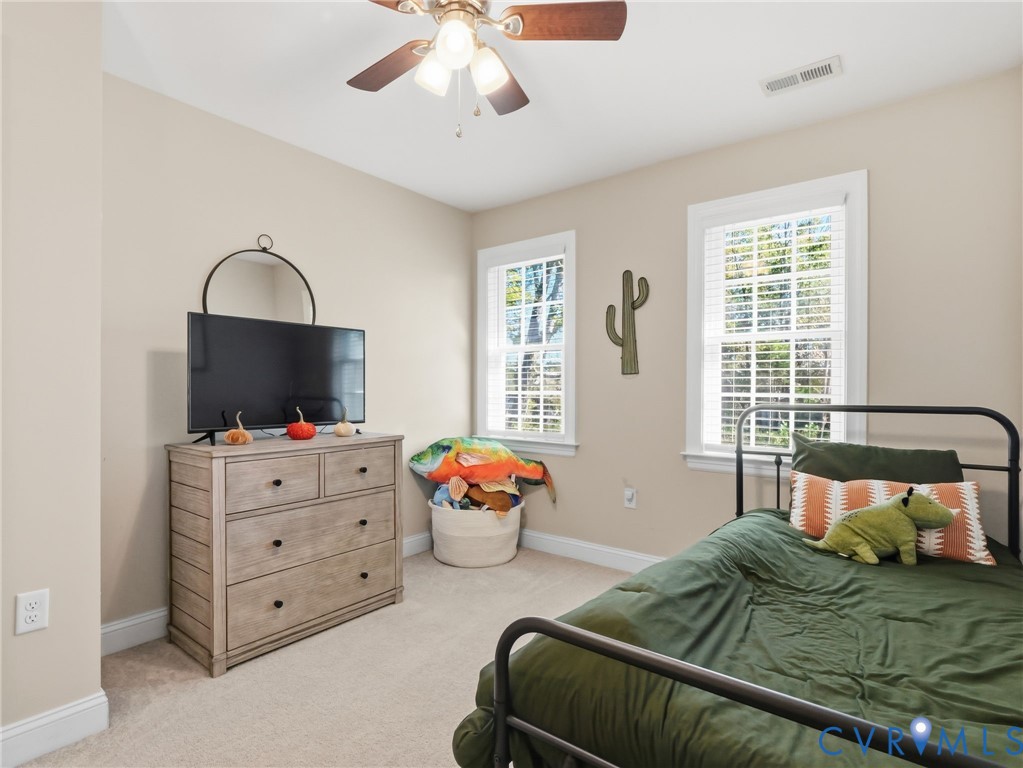 11084 West River Road Aylett, VA 23009 - Photo 22 of 36 a bedroom with furniture and window