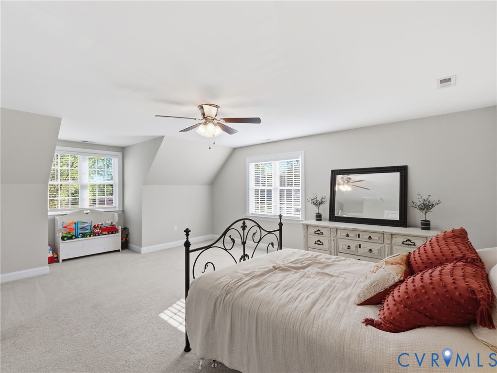 11084 West River Road Aylett, VA 23009 - Photo 24 of 36 a bedroom with a bed mirror and window