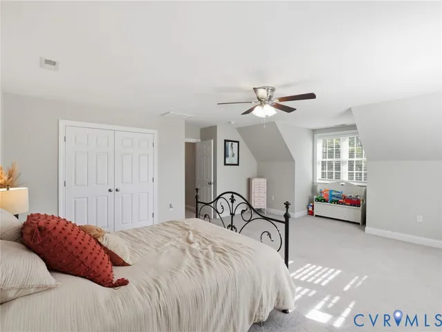 a bedroom with furniture and white walls