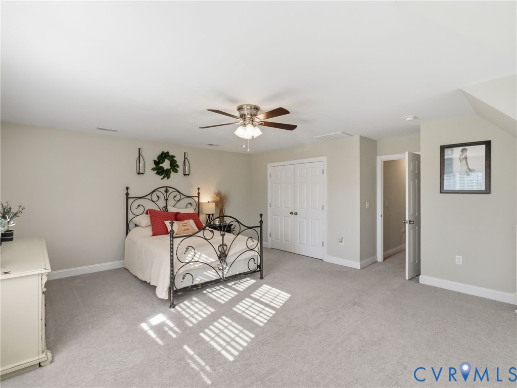 11084 West River Road Aylett, VA 23009 - Photo 26 of 36 a bedroom with furniture and white walls