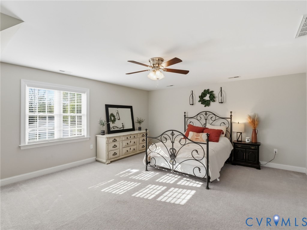 11084 West River Road Aylett, VA 23009 - Photo 27 of 36 a spacious bedroom with a bed and a window