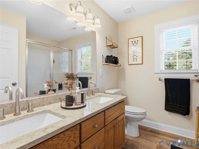 a en suite bathroom with a sink and mirror
