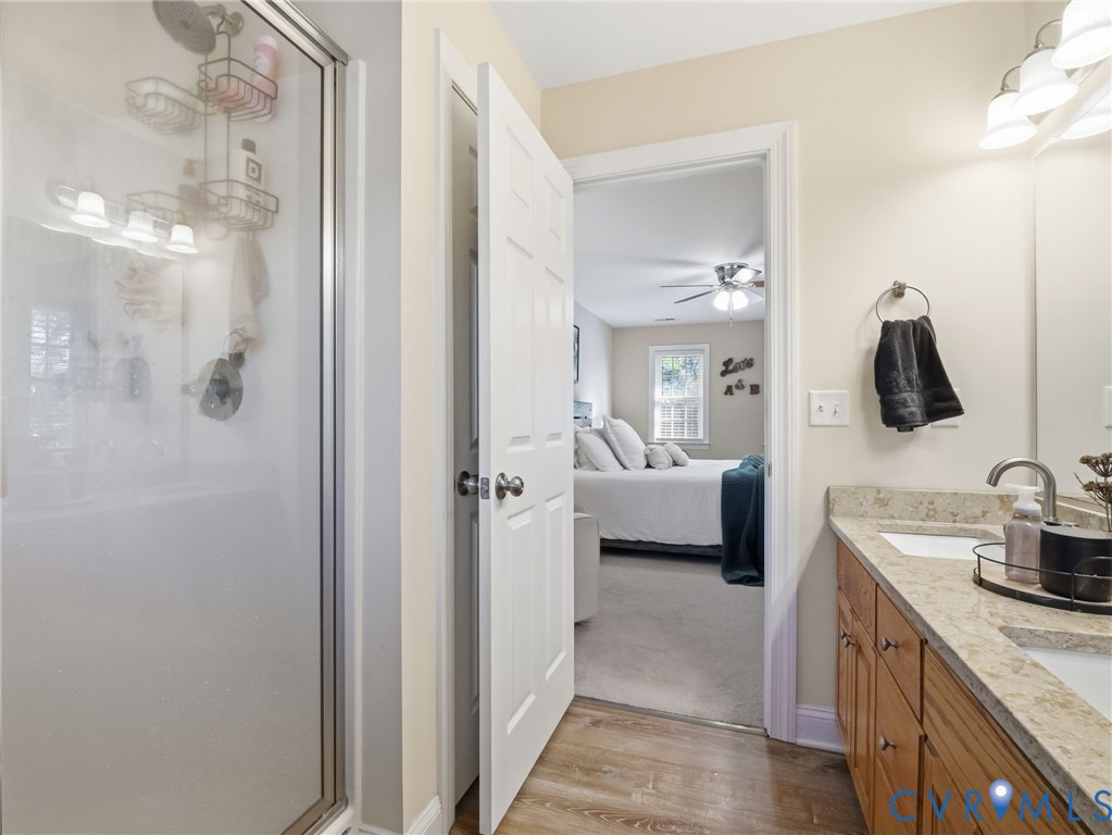11084 West River Road Aylett, VA 23009 - Photo 30 of 36 a en suite bathroom with a sink and mirror