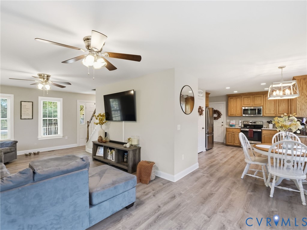 11084 West River Road Aylett, VA 23009 - Photo 8 of 36 a living room with furniture kitchen view and a wooden floor