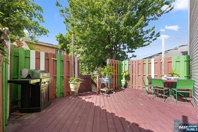a view of a house with backyard porch and sitting area