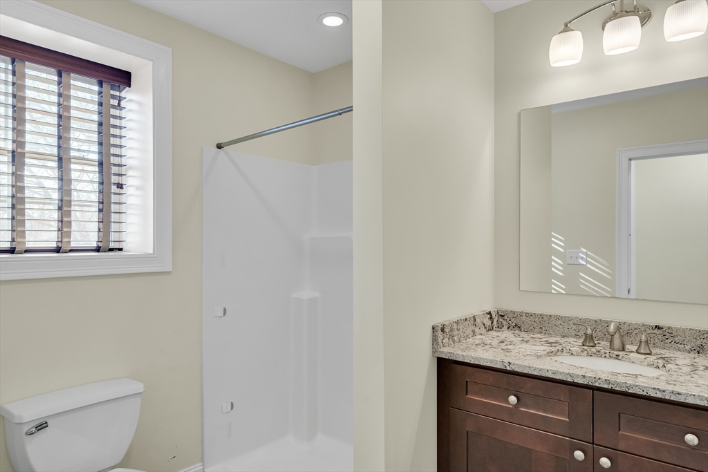 19 3rd Road Woburn, MA 01801 - Photo 34 of 41 a bathroom with a granite countertop sink toilet and a mirror