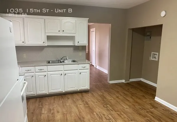 a view of cabinets with wooden floor