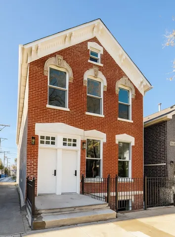 a front view of a house with a garage