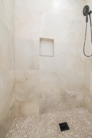 a vase of flowers sitting on a floor