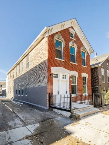 a front view of a house with a garage