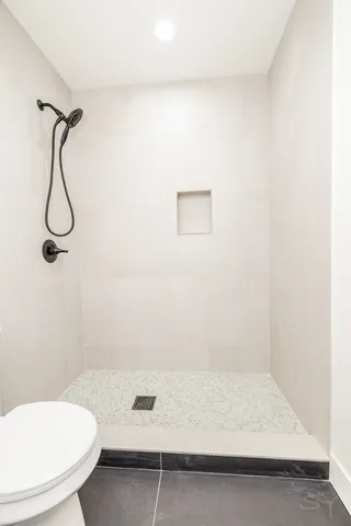 a bathroom with a sink a toilet and tub