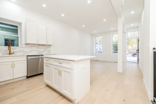 a view of a kitchen with a sink