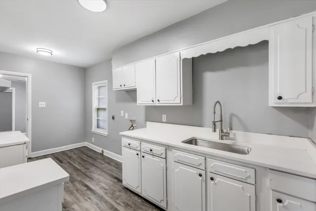 a kitchen with a sink and cabinets