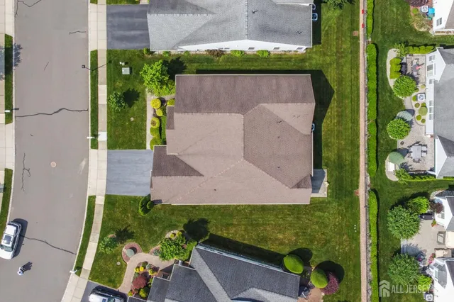 an aerial view of a house with a garden