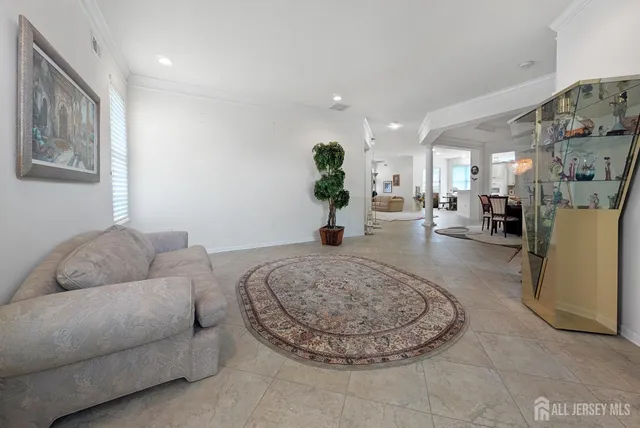 a living room with furniture and a rug