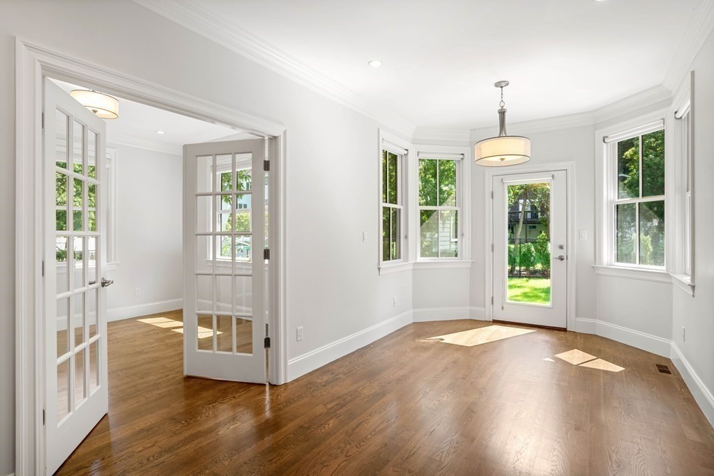 38 Wendell Road Newton, MA 02459 - Photo 11 of 42 a view of an empty room with wooden floor and a window