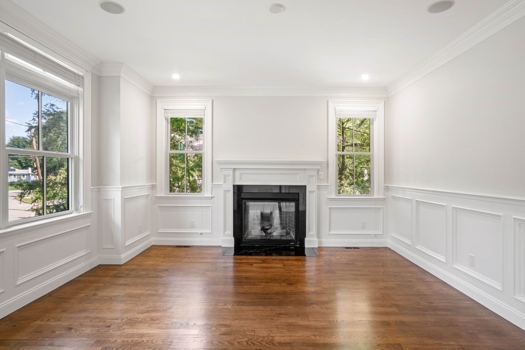 38 Wendell Road Newton, MA 02459 - Photo 12 of 42 an empty room with windows and fireplace