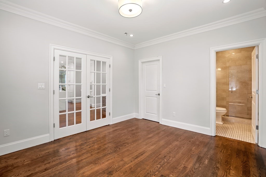 38 Wendell Road Newton, MA 02459 - Photo 18 of 42 a view of an empty room with wooden floor and a window