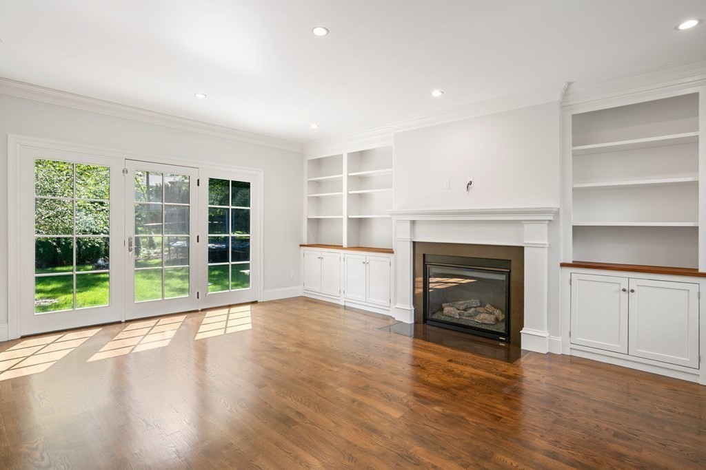 38 Wendell Road Newton, MA 02459 - Photo 20 of 42 a view of an empty room with a window and fireplace