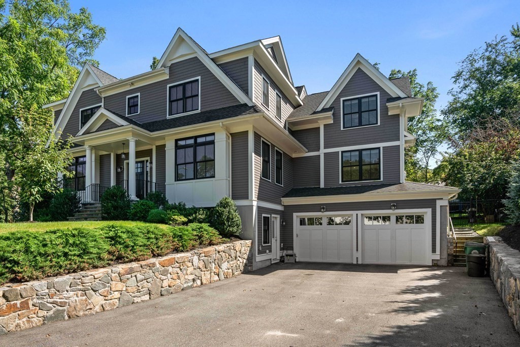 38 Wendell Road Newton, MA 02459 - Photo 2 of 42 a view of a white house with a large windows and a yard