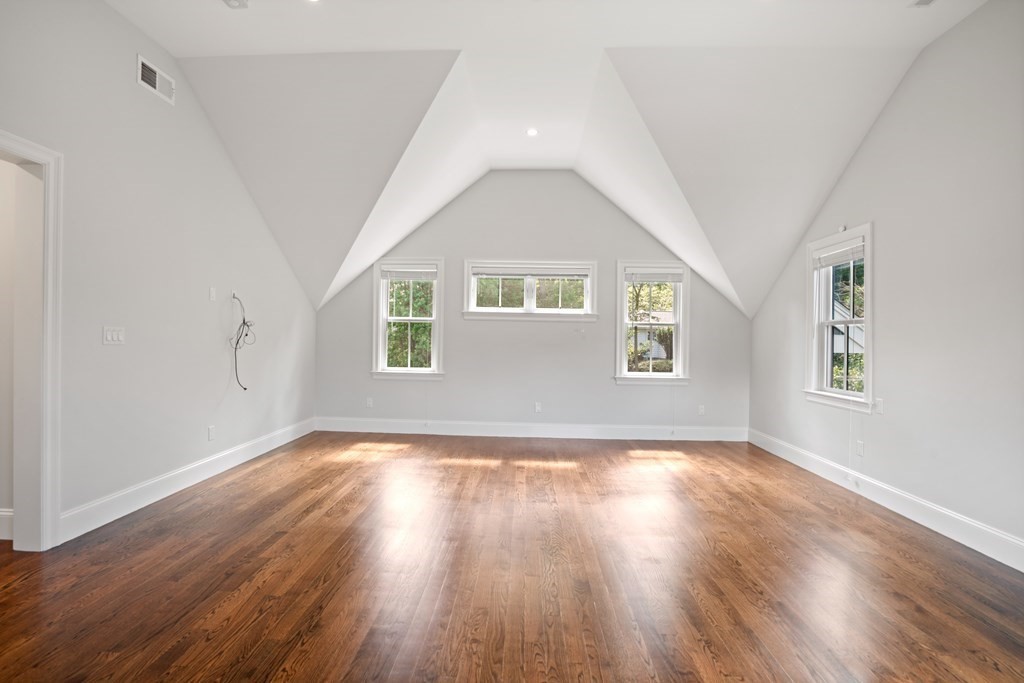 38 Wendell Road Newton, MA 02459 - Photo 23 of 42 a view of an empty room with wooden floor and a window