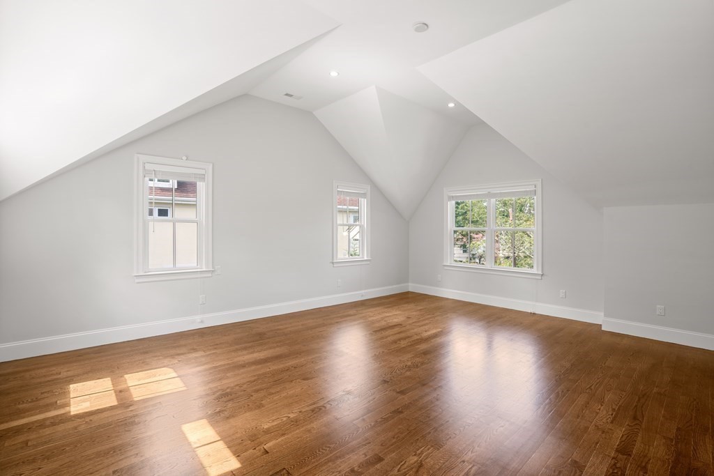 38 Wendell Road Newton, MA 02459 - Photo 24 of 42 an empty room with wooden floor and windows