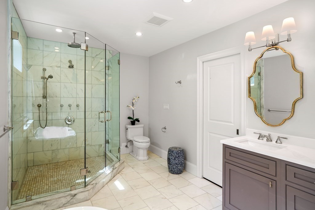 38 Wendell Road Newton, MA 02459 - Photo 25 of 42 a bathroom with a double vanity sink mirror and shower