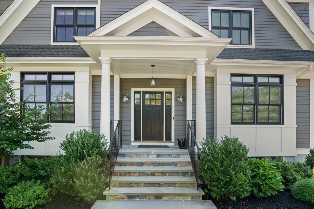 38 Wendell Road Newton, MA 02459 - Photo 3 of 42 a front view of a house with potted plants
