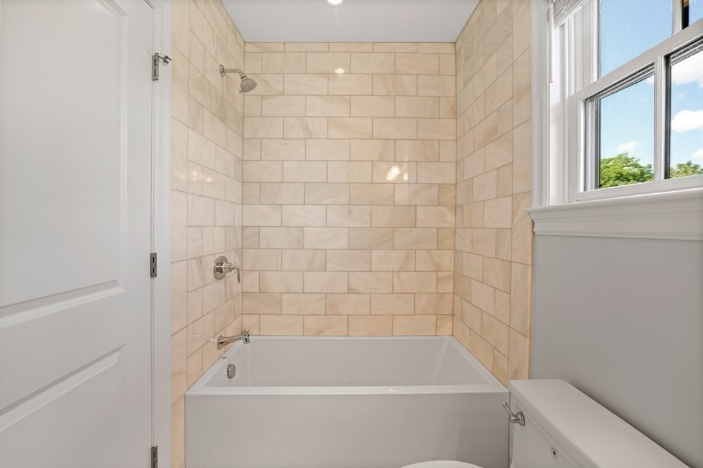 38 Wendell Road Newton, MA 02459 - Photo 32 of 42 a bathroom with a tub and a window